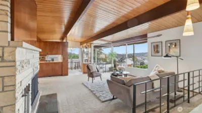 Original Missouri hardwoods under carpet and custom light fixtures add to the mid-century modern charm