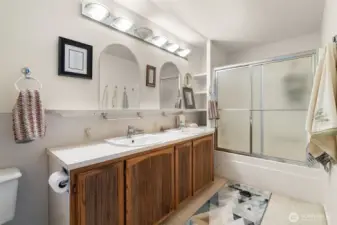 The ensuite bathroom includes a tub/shower combination and double sinks.