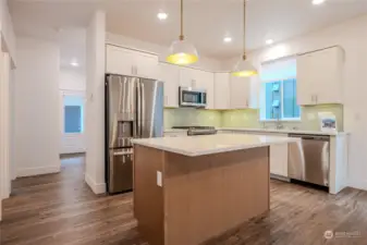 Thoughtfully designed with a modern flair, this kitchen features abundant quality cabinetry, a stainless steel, single large basin sink and garbage disposal and energy efficient appliances. Little things can go a long way, like eliminating the visibility of the microwave venting for a more clean & usable space.