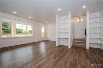 Attractive Luxury Vinyl Plank flooring, abundant recessed lighting & modern fixtures are found throughout the Main Floor. The Smart Home Center to the left of the stairway features built-in shelves & a data port. The Smart Home tablet serves as the home base for the Home Automation Suite. (video doorbells, lighting, thermostats, door locks & voice control functionality)