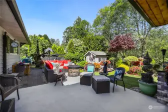 Breathtaking parklike setting complete with rock paths, paver-lined flower beds, and mature trees