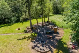 200lb capacity smoker, fire pit, rifle range, archery range, horseshoe pit. Power has been run to this area.