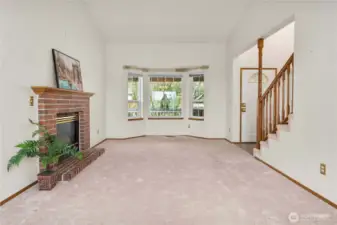 Looking back toward the entry and the bay window. Outside the window is a large covered deck.