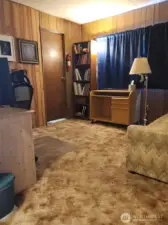 Looking into the second bedroom from the hallway.  Door leads to 3/4 bathroom.