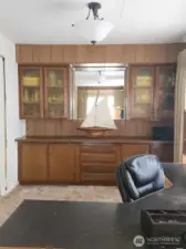 Plenty of storage throughout this home, including generous built-ins. To the left of this dining room is the galley kitchen.