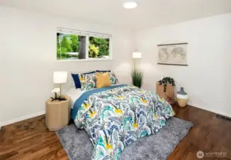 Primary bed has hardwood flooring