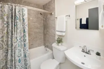 updated bath with tile backsplash