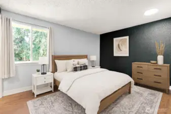 Virtual staging of the primary bedroom with walk in closet and ensuite.