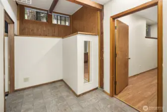 Pass through space from the game room to the ADU.  This could be the closet/storage area for the ADU easily.
