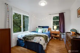 One of two bedrooms off of the first living room with hardwood floors!