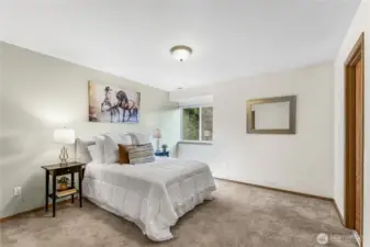 Primary bedroom that is very spacious and has walk in closet.