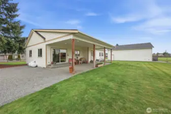 Manicured lawn- owned propane tank- Shop in the background.  Clean as a whistle!