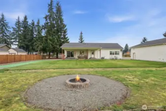 Looking over the firepit to the back of the house & shop.  You can see the stars clearly at night - not a lot of light pollution.