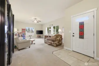Inside the front entry- main living space connects to the kitchen on the left.