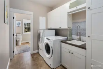 Utility room with 3/4 bathroom attached