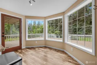 Dining area off kitchen with beautiful bay windows