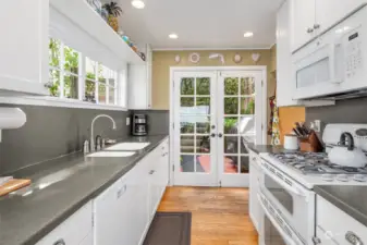 Updated kitchen with new cabinetry.