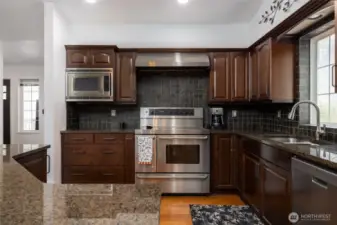 Beautiful Stainless Steel Appliances, convection oven, gorgeous custom cabinets, walk-in pantry and more.