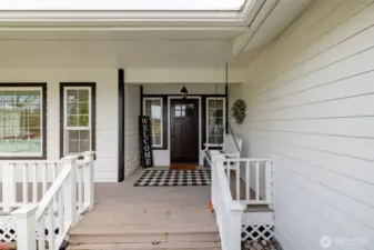 Welcoming covered front porch on main home.