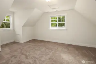 One of two upper level bedroooms, generous in size