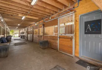 Main barn with 14 stalls, powder room, 2 tack rooms, matted paddocks off each stall.