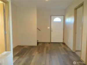 ANOTHER VIEW OF THE ENTERTAINMENT AREA TOWARD THE FRONT DOORWAY!