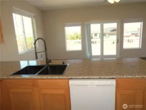 STILL BE A PART OF THE PARTY OR CONVERSATION WITH THE OPEN CONCEPT LIVING AREA/KITCHEN!