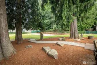 Winding path to sports court & out buildings