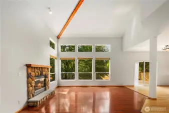 Living Room w/ Fireplace & High-Vaulted Ceilings