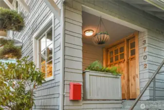 Charming front porch stoop to greet your guests with covered porch for those rainy Seattle days.