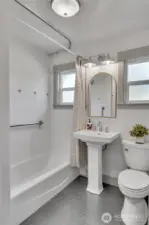 Full bath on the main, with adjacent laundry hook up.