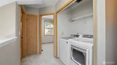 Laundry is conveniently located on the upper floor.