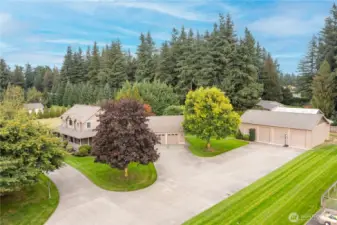 Well-appointed property with a total of 2.28 Acres, large 2 car garage, 36x65' shop with heated workshop & office, generous parking plus full RV hook-ups!