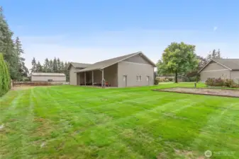 A lean-to off the shop provides space for hobbies or potential horse stalls