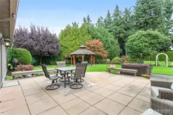 Large patio with lower patio space is a perfect place to entertain