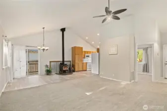 Door on the right is a bedroom. Entry to home is next to it with shoe storage cabinet and coat rack.