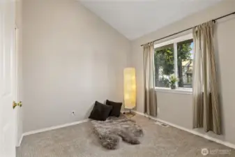 Bedroom located near the living area. Would make a great home office with a view of the front yard! Closet is to the left of the picture.