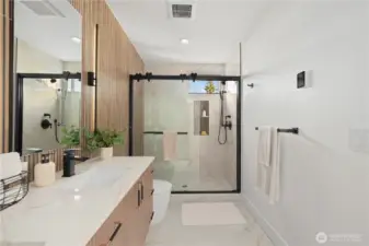 Bathroom has under vanity lighting + heated floors!