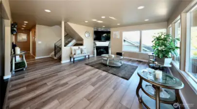 Spacious main floor living room with newer flooring thruout