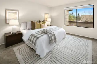 Primary suite sits at back of unit, overlooking balcony.