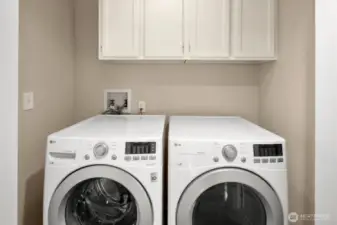 Laundry closet with storage in hall. Washer and Dryer convey!