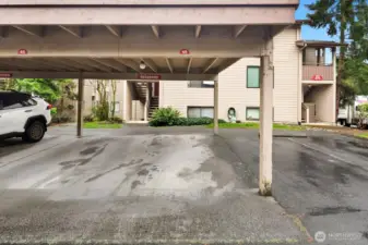 Designated, covered parking space sits just outside unit.