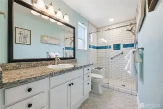 Primary bath with custom-tiled shower