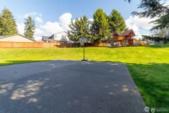 Basketball court & lawn area a short walk from the house