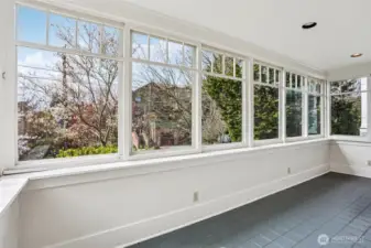 Spacious enclosed sun porch.