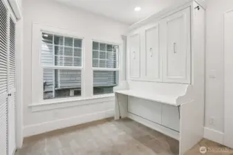 Main floor bedroom 1 with build in murphy bed.
