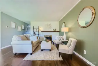 Enter to newly finished hardwood floors and a cozy fireplace living room