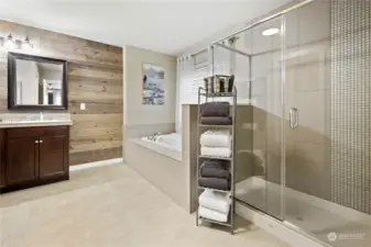 Owners' suite with large tile shower soaking tub double vanity