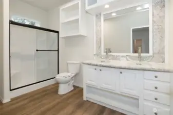 Deluxe Primary bathroom with oversized shower and window overhead