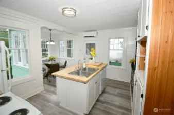 Updated kitchen with breakfast nook and butcher block countertop